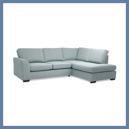 Light blue corner sofa with dark wood feet